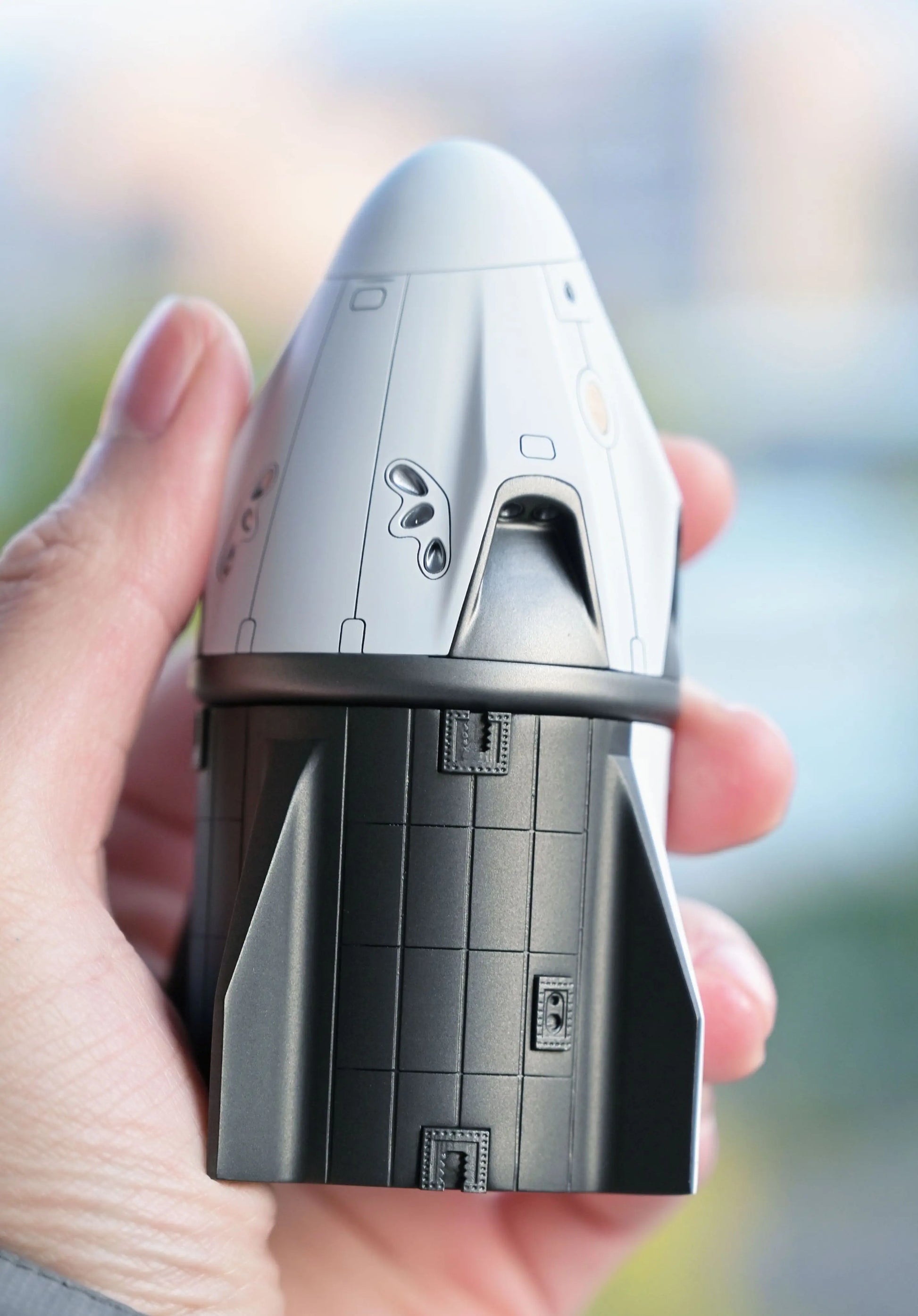 SpaceX Crew Dragon in 1/72 scale view in hand